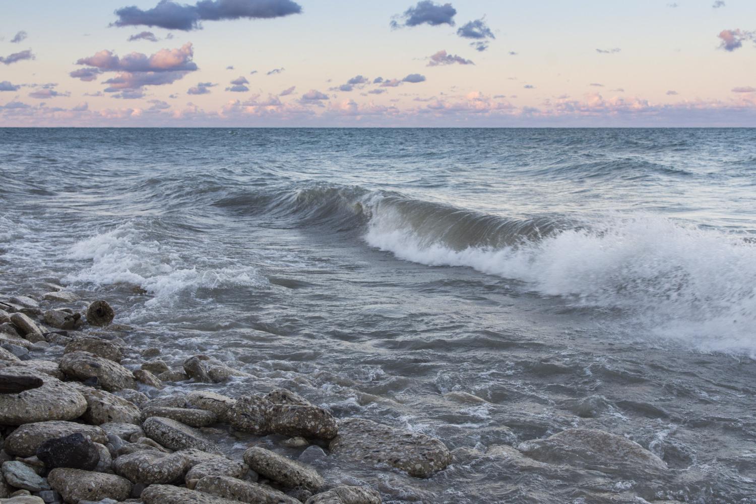 The sun rises over Lake Michigan on the <a href='http://7z9.dianhanwang8.com'>BETVLCTOR伟德登录</a> campus.